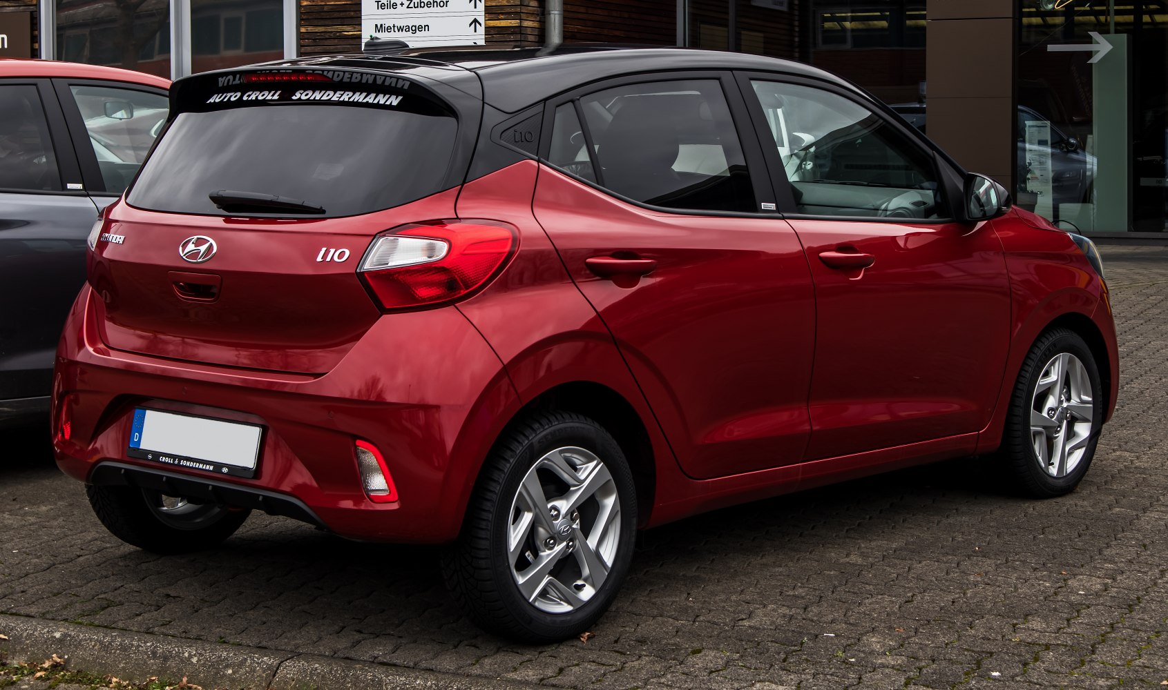 Rear and side profile of a modern compact hatchback with alloy wheels.