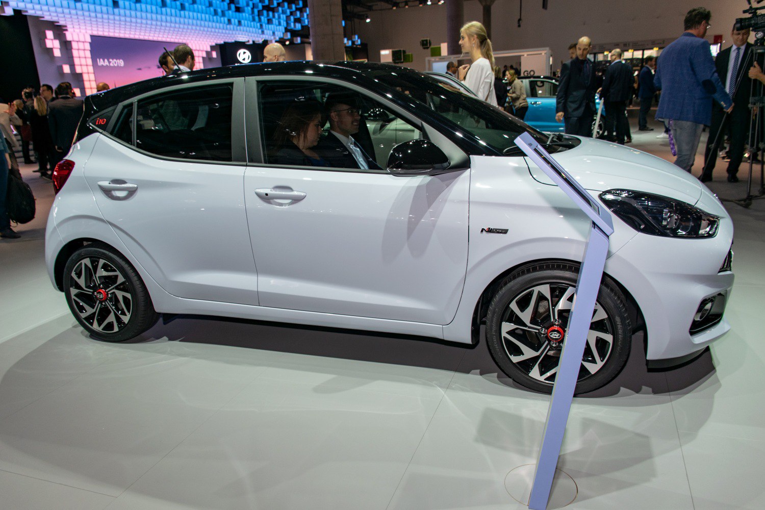 Side profile of a compact hatchback with sporty alloy wheels