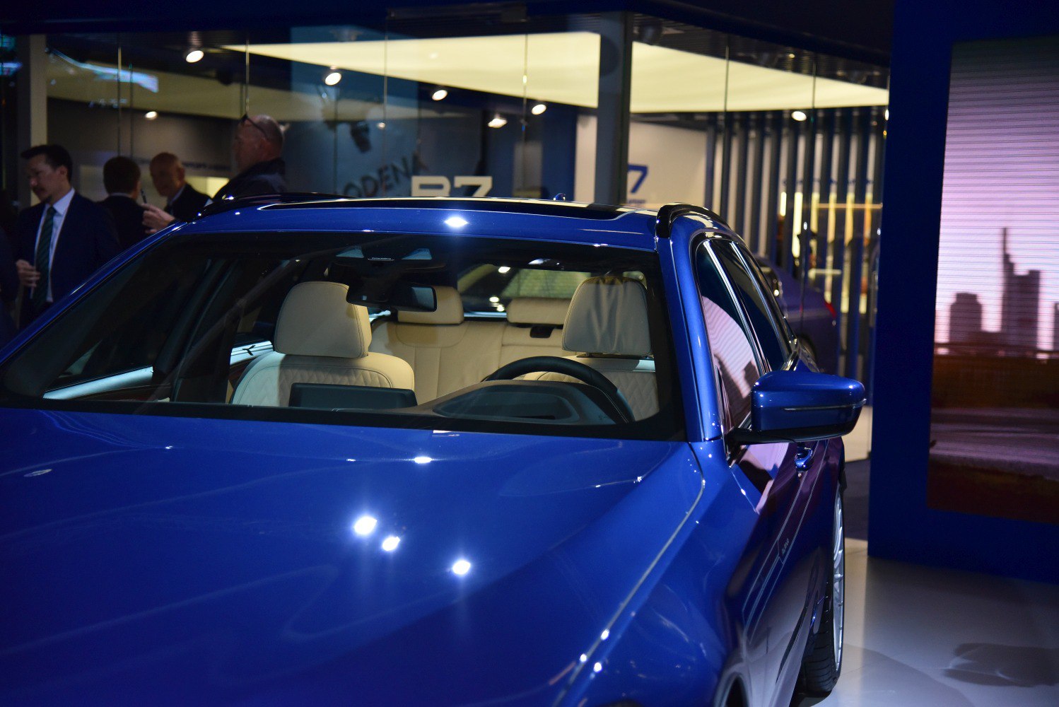 Glossy blue wagon with beige leather seats and sunroof