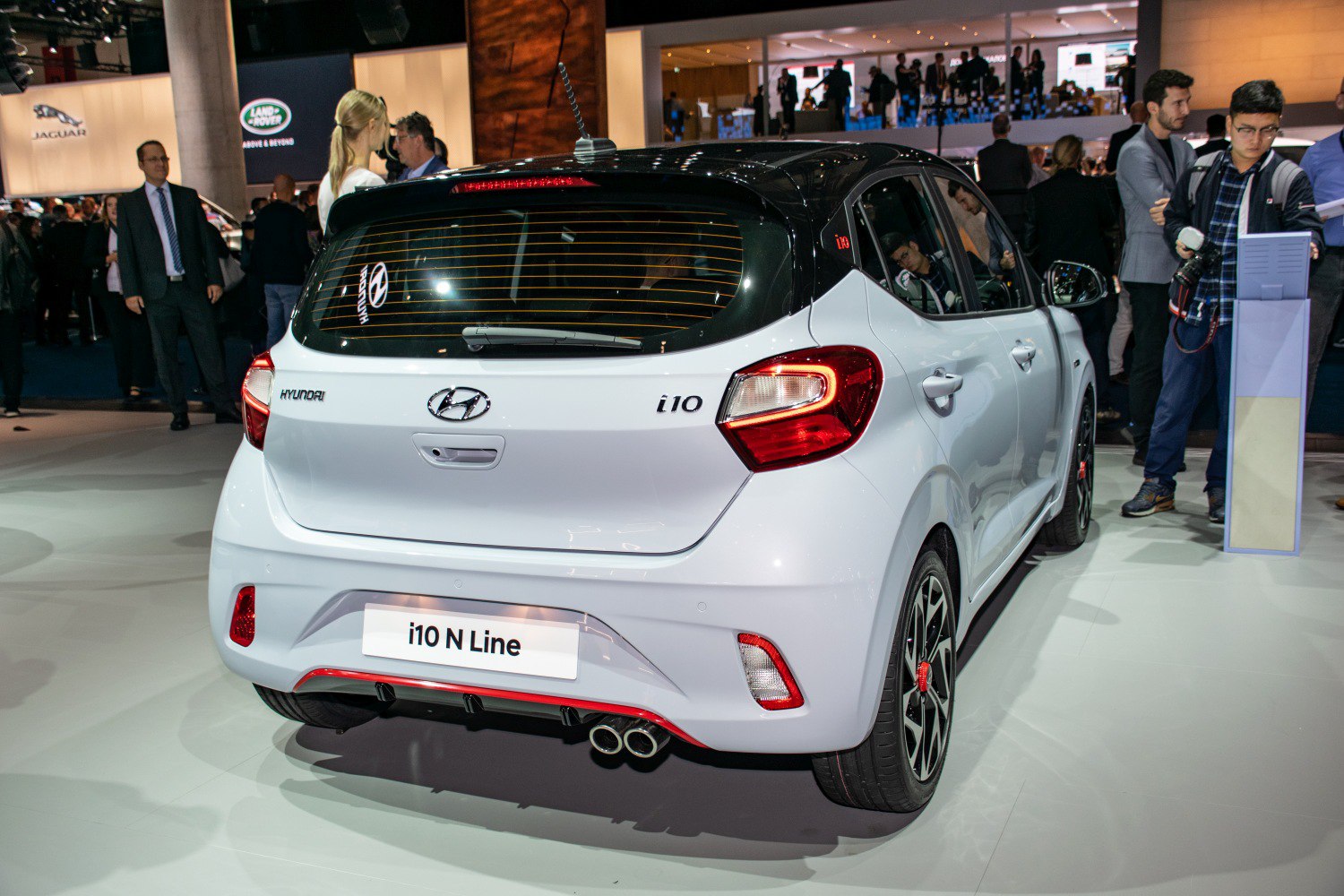 Sporty hatchback rear with dual exhausts and black roof accents