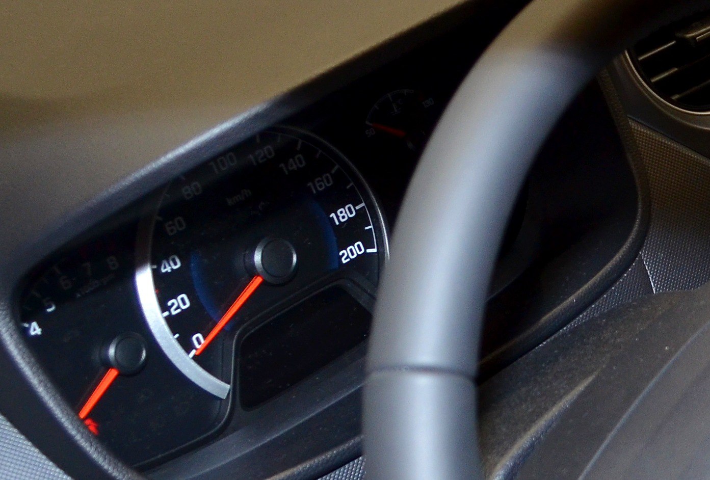 Close-up of a car dashboard speedometer and instrument cluster