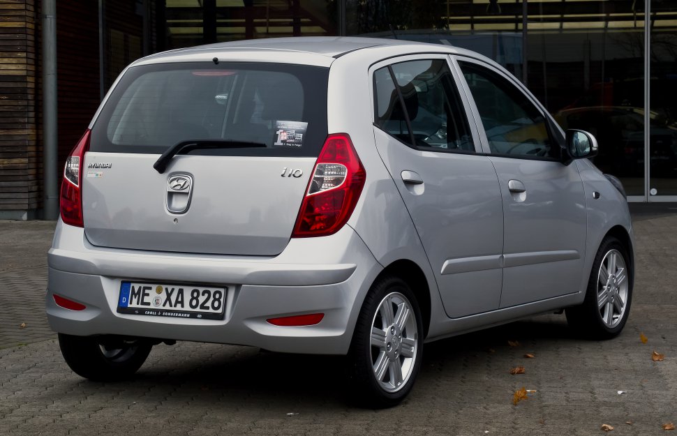 Rear and side view of silver compact hatchback with five doors