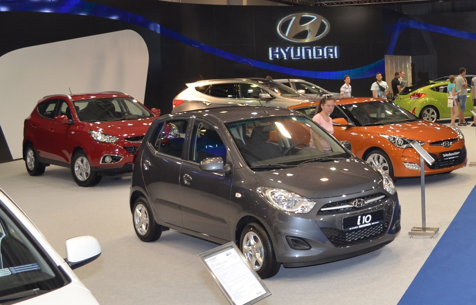 Compact gray hatchback with modern headlights and smooth body lines