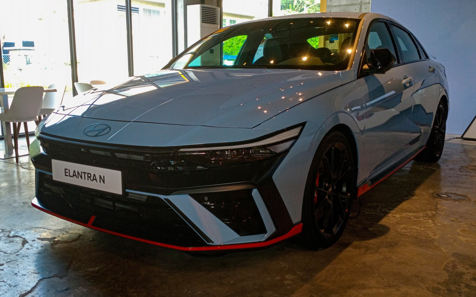Front view of sporty sedan with aggressive bumper and sharp headlights