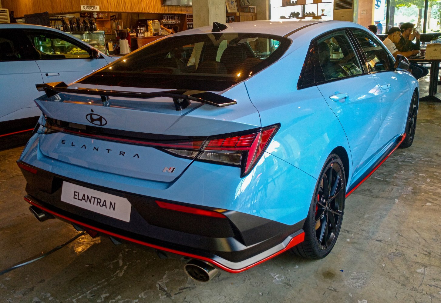 Rear view of sporty sedan with spoiler and unique taillights