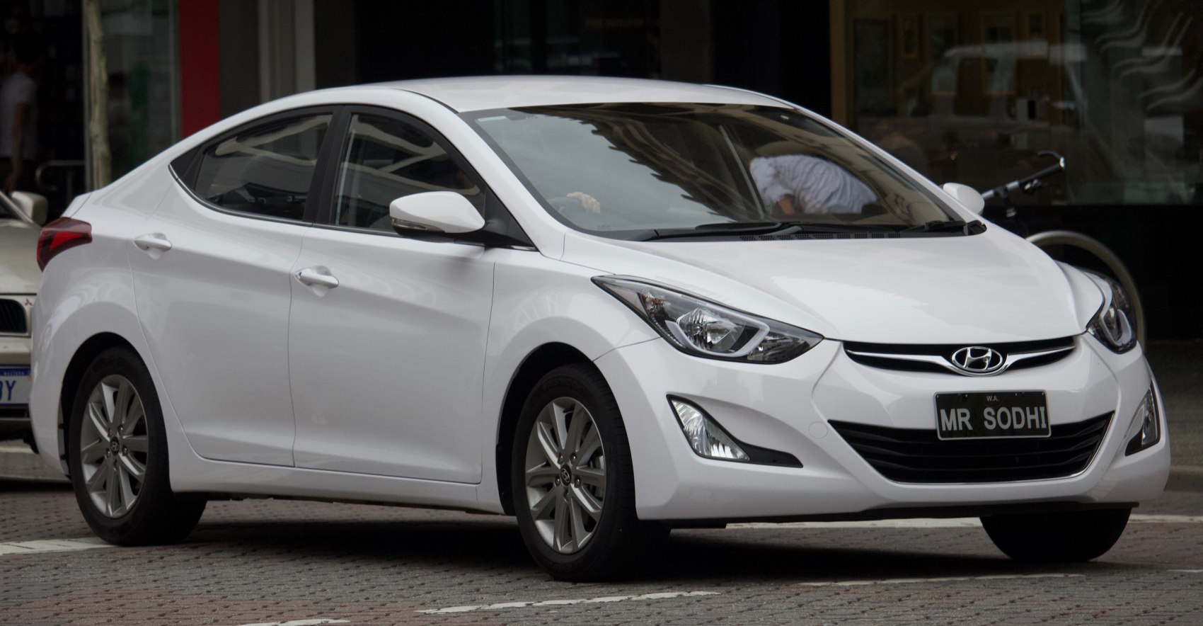 White sedan with modern headlights and sleek aerodynamic design