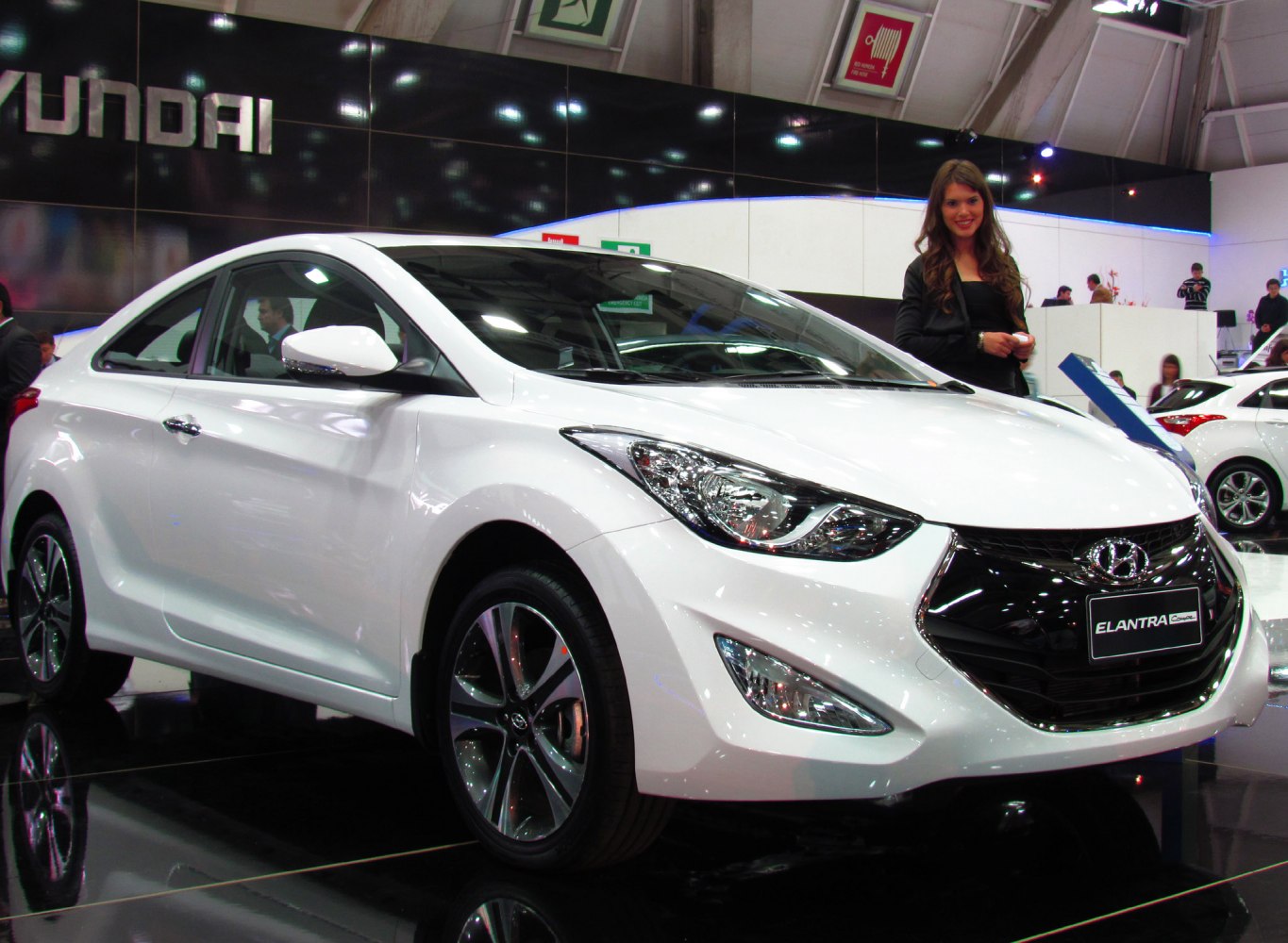 Front side view with sleek headlights and alloy wheels