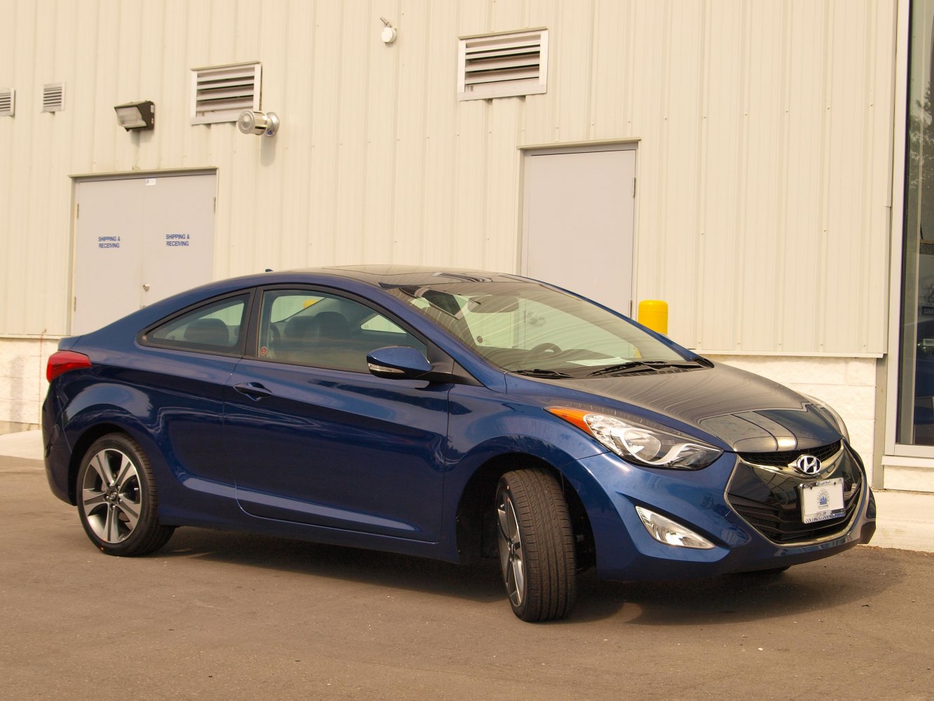 Sporty coupe with aerodynamic design and front-side view