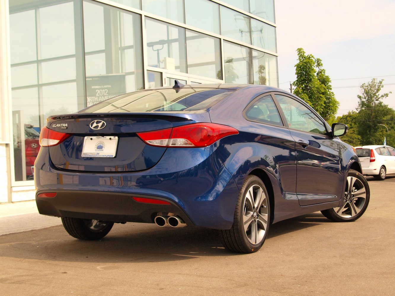 Rear view with dual exhaust and alloy wheels