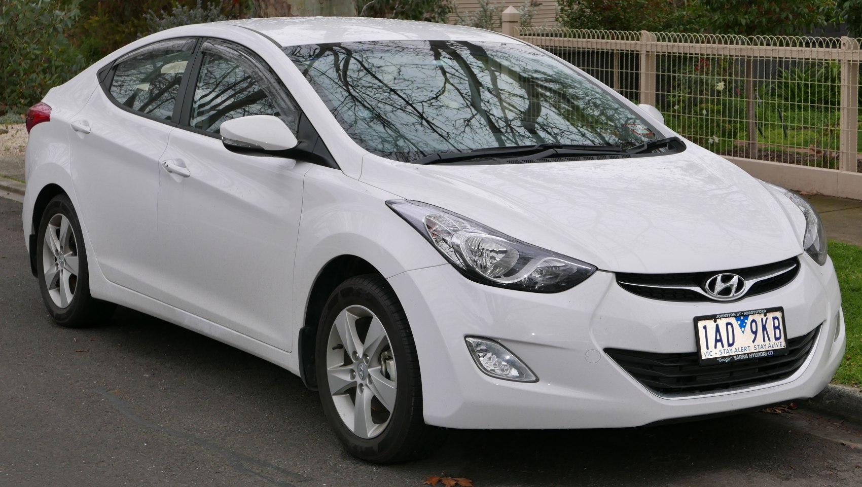 Front-side view with aerodynamic headlights and alloy wheels
