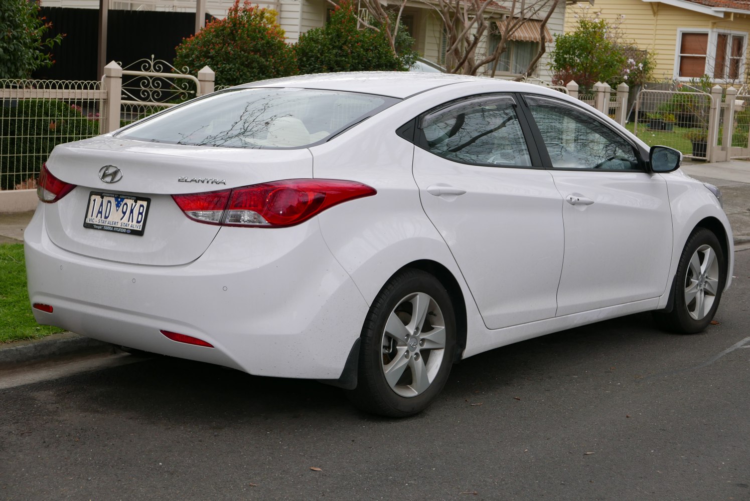 Rear side view with taillight design and aerodynamic sedan shape