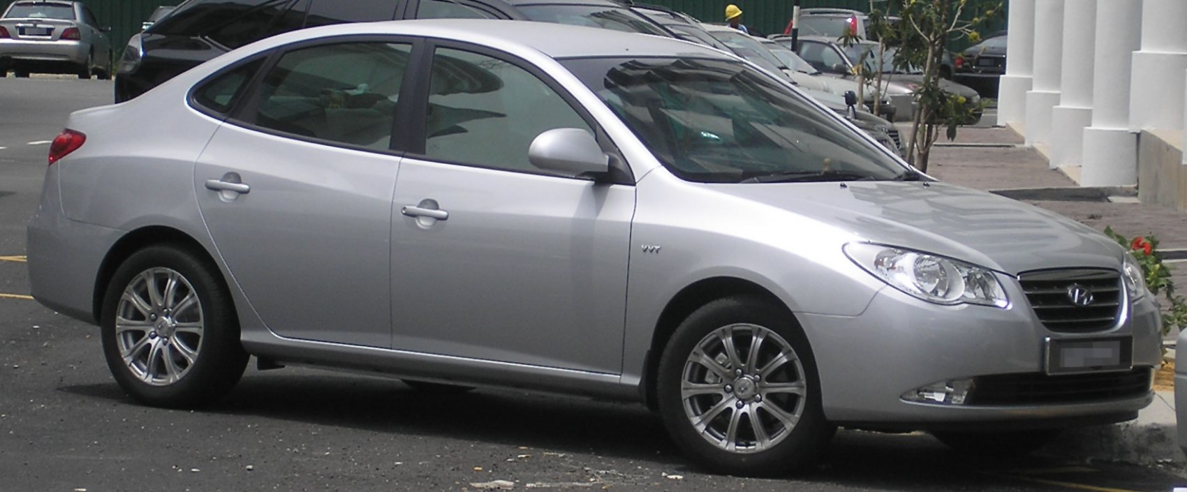 Silver sedan side profile with alloy wheels and sleek design
