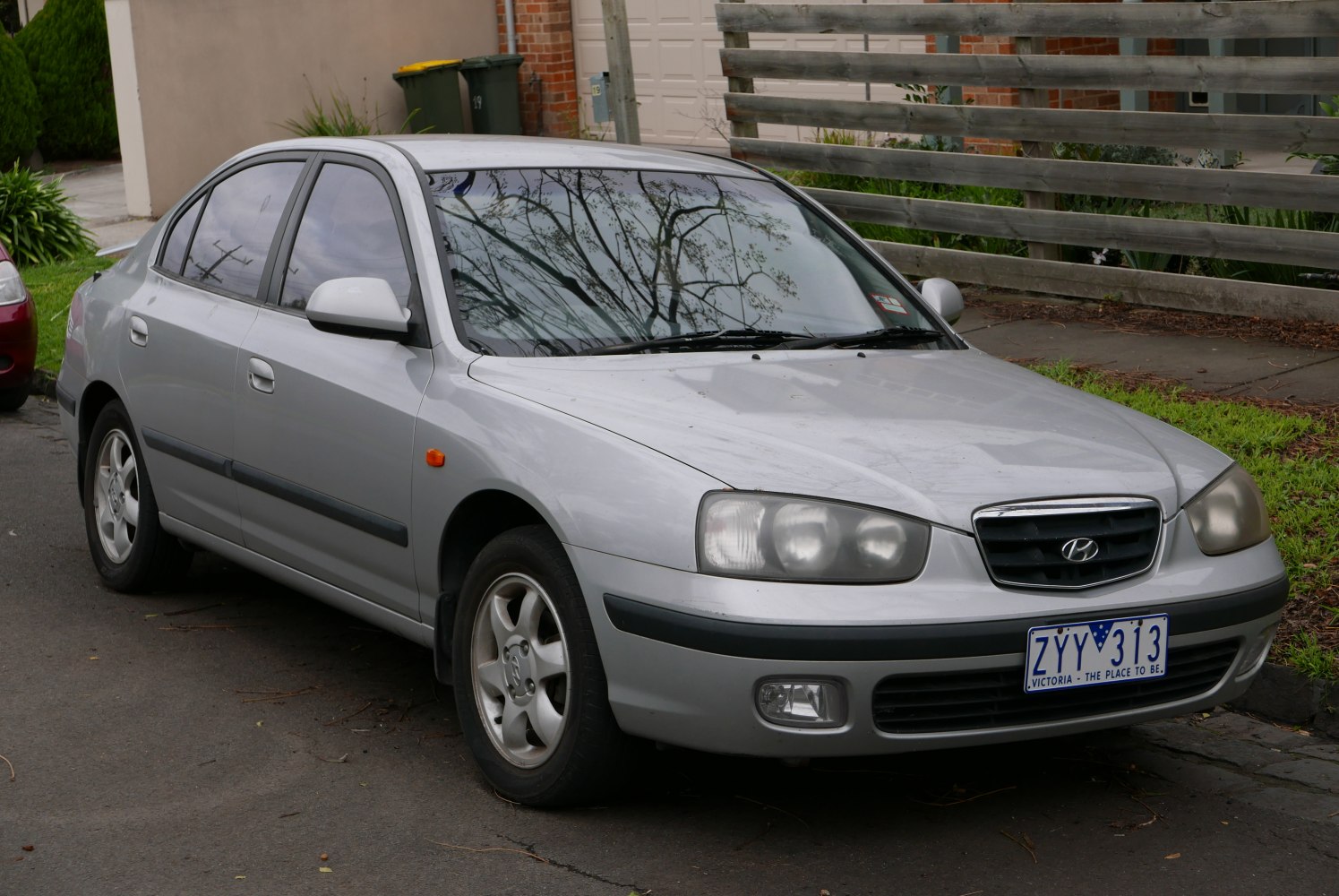 Front and side view of a sedan with distinctive grille and headlights