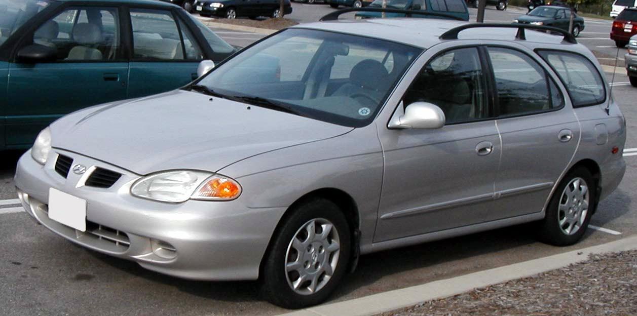 Silver mid-size hatchback with angular headlights and side mirrors
