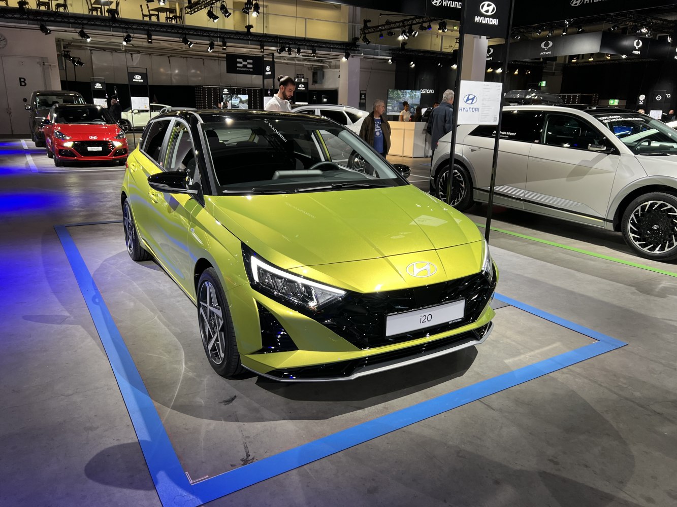 Front view with angular LED headlights and bold black grille.