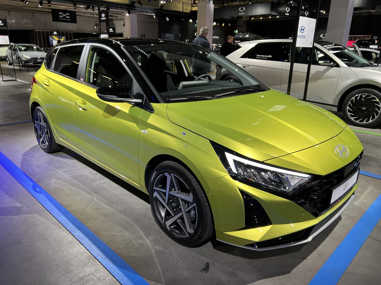 Front and side view with LED headlights and geometric grille