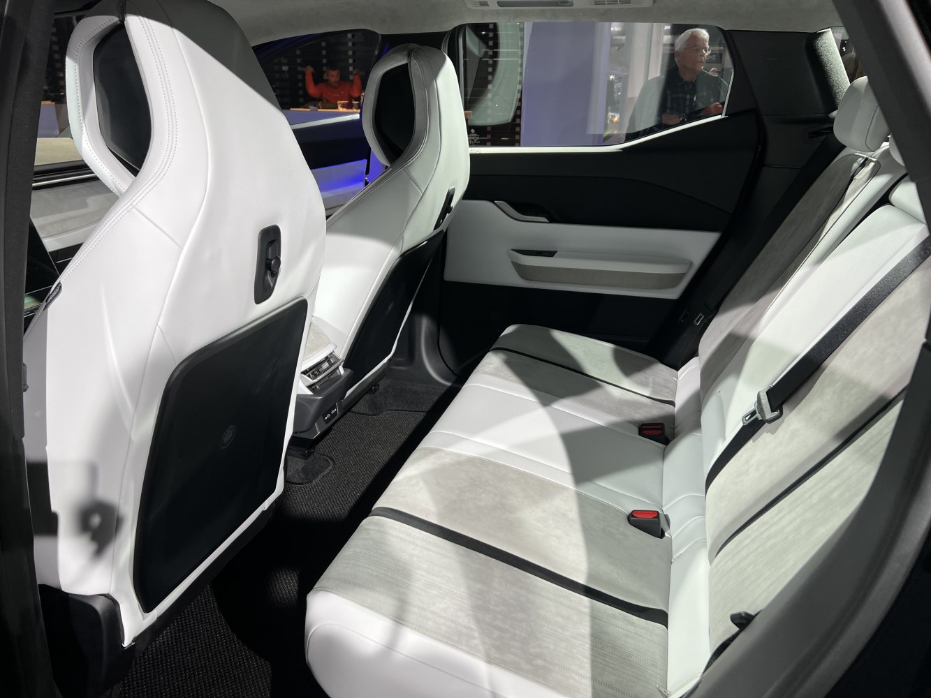 Rear interior with modern white seats and spacious cabin