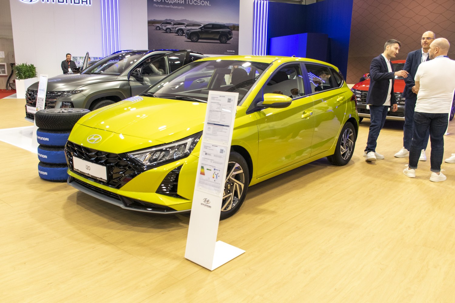 Bright yellow modern hatchback with sharp front grille and headlights