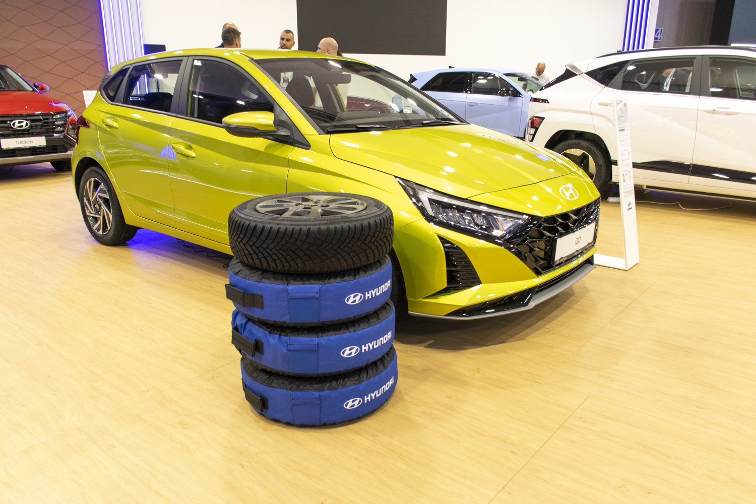 2023 Hyundai i20 front view with blue-covered winter tire stack