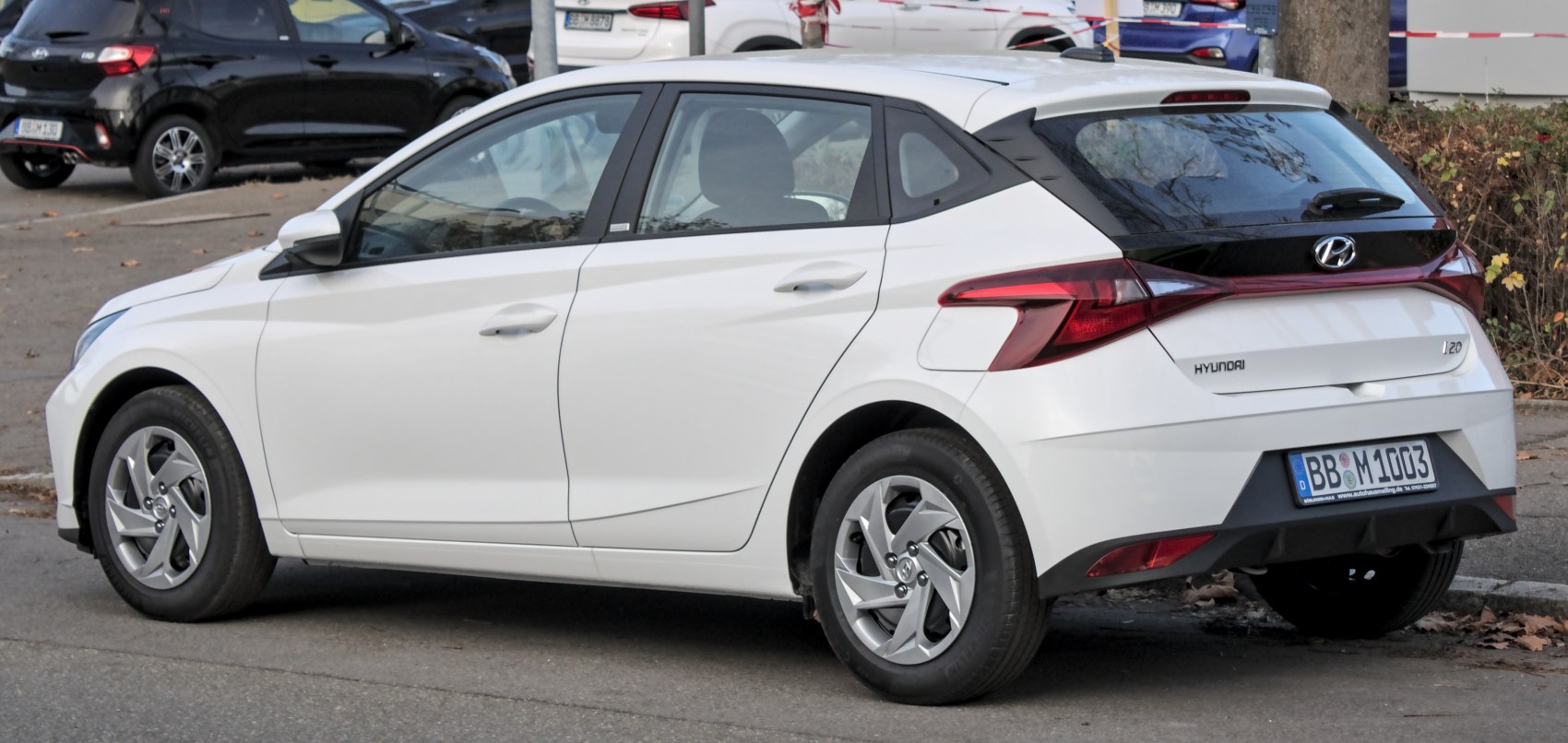 White hatchback rear and side view with modern taillights and sleek design