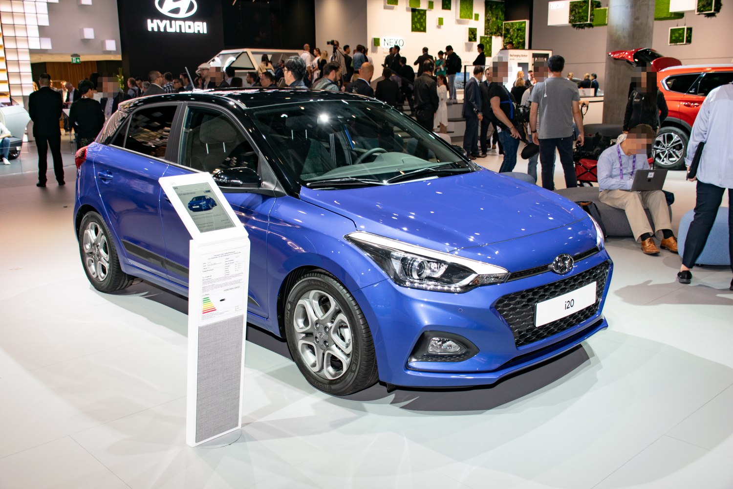 Blue two-tone hatchback front side view with alloy wheels