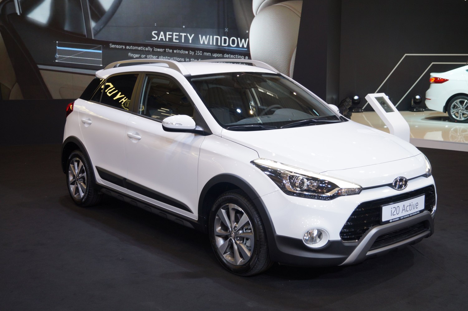 White compact crossover with sleek headlights and alloy wheels