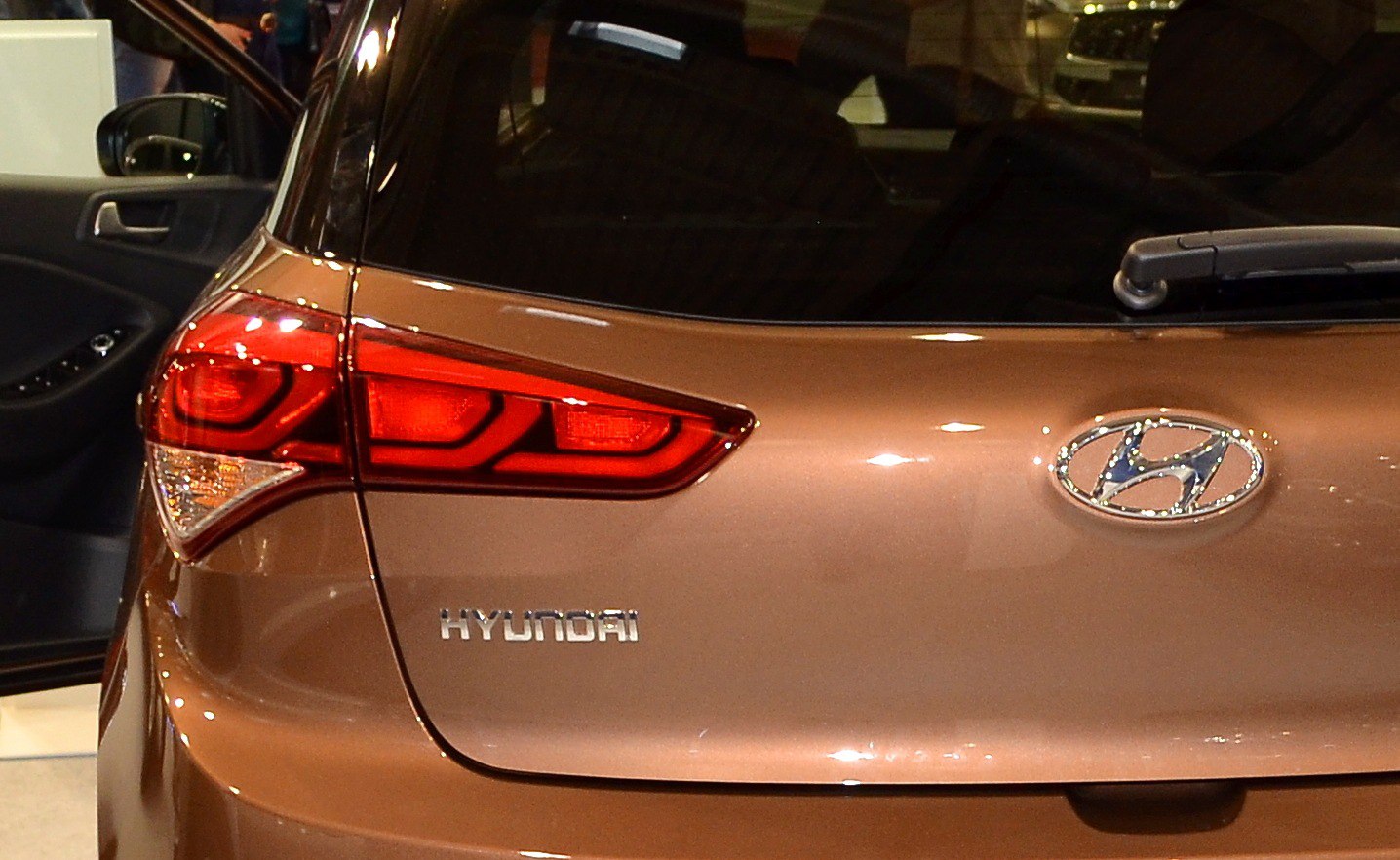 Rear view of hatchback with distinctive taillight and Hyundai badge