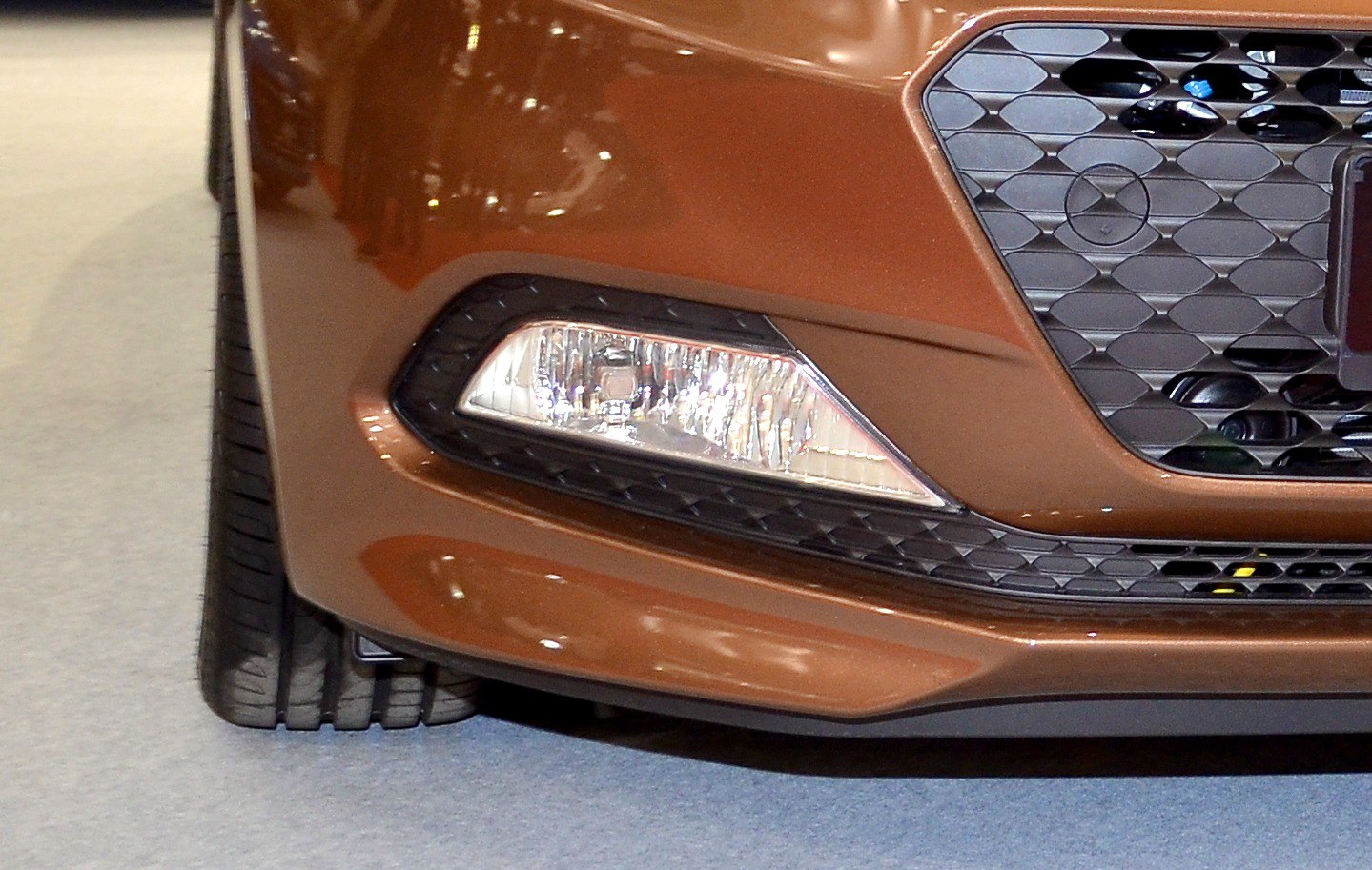 Close-up of front left fog light and grille section