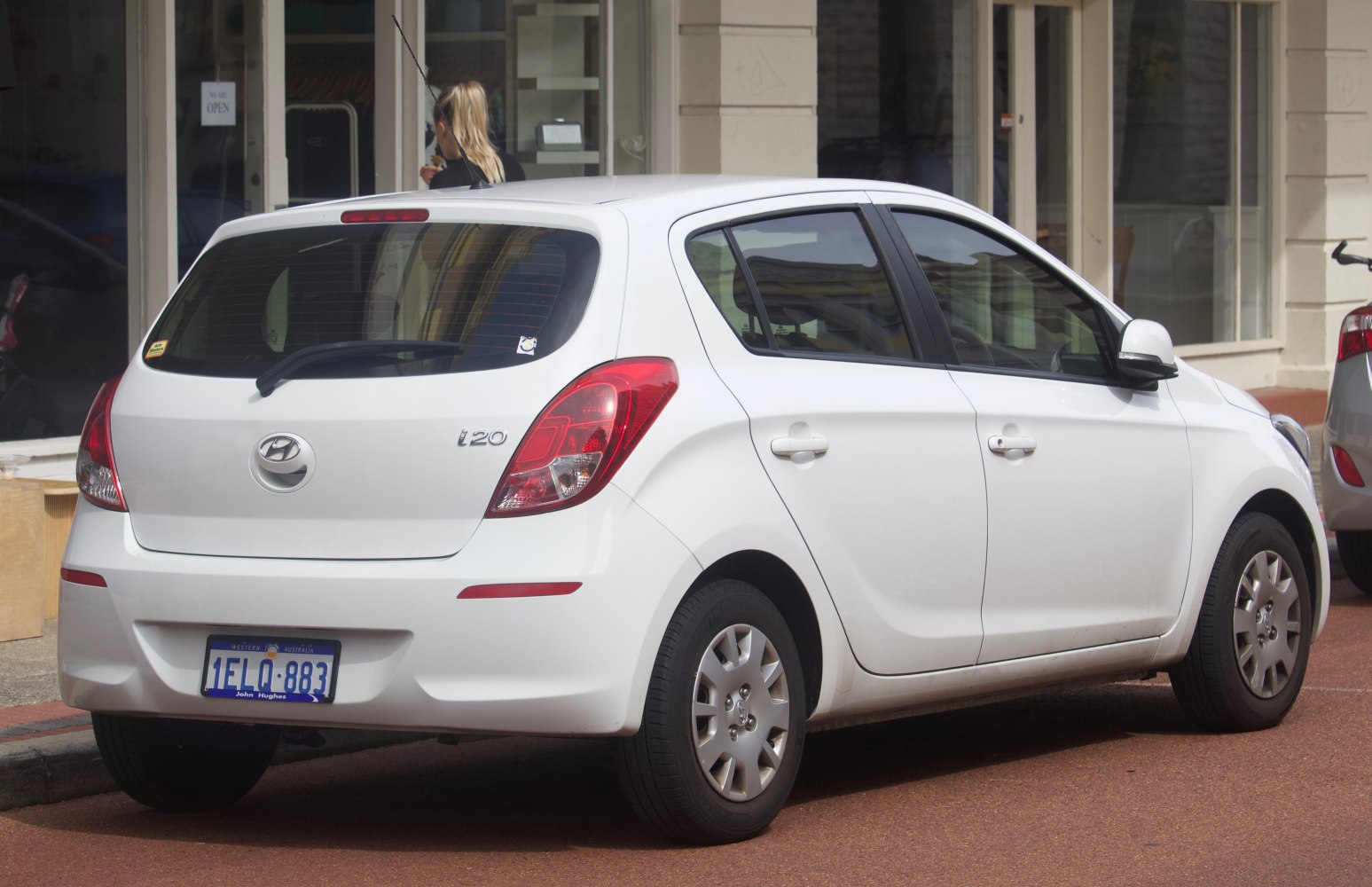 Rear side profile of a white 5-door hatchback