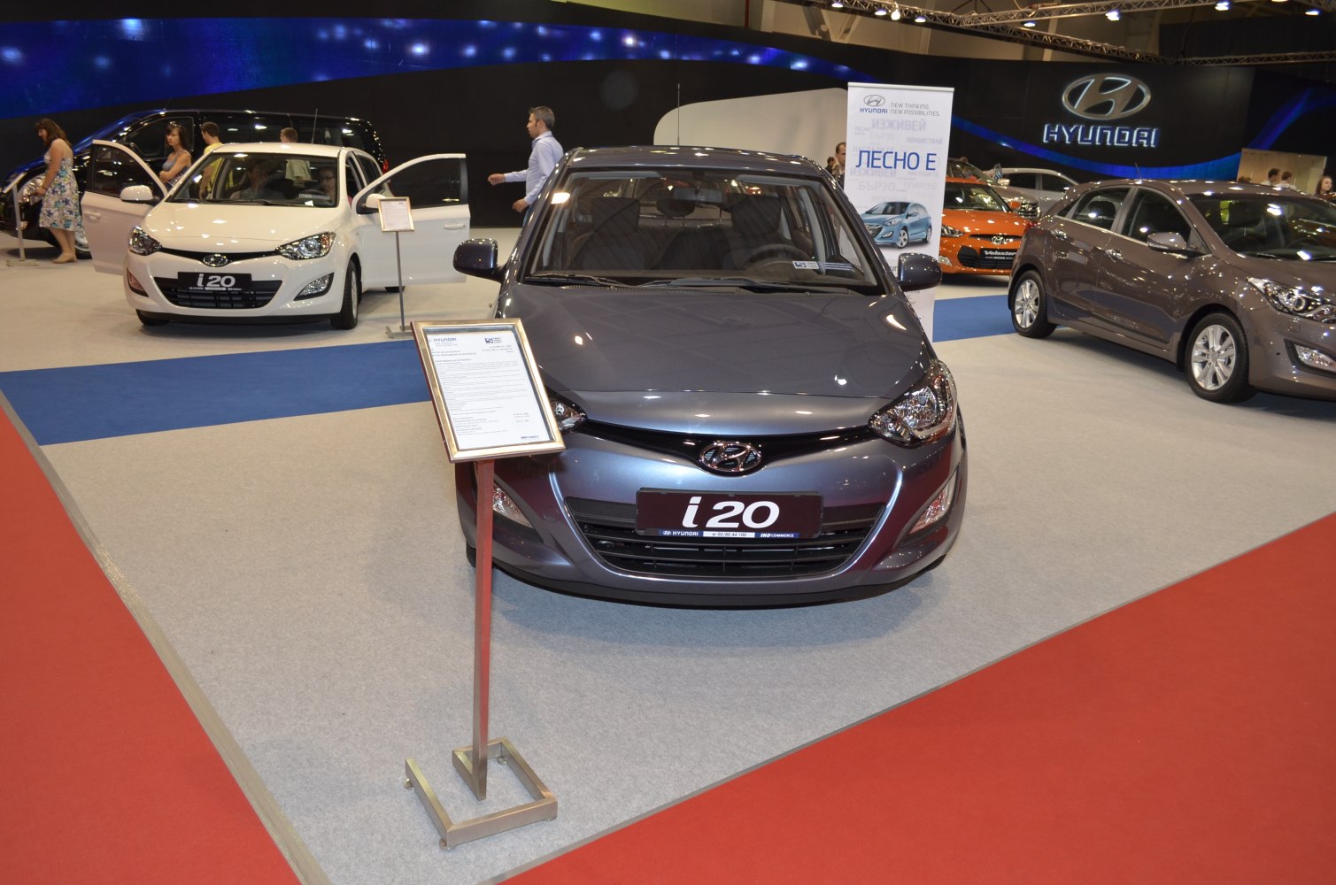 Front view of Hyundai i20 I PB facelift with info stand and showroom environment