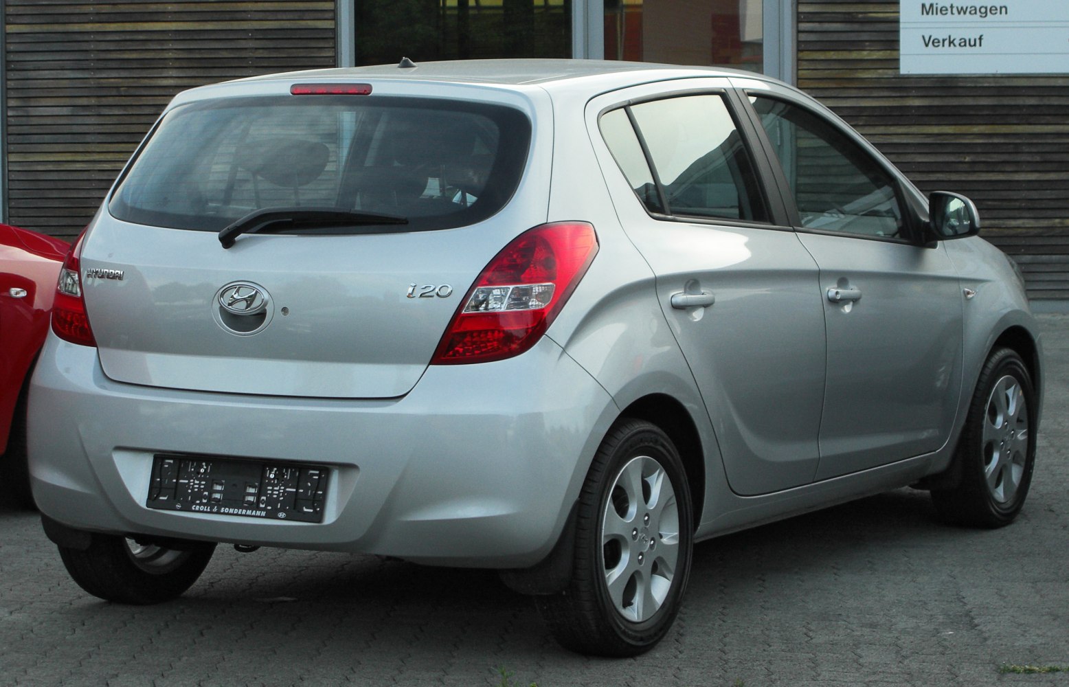 Rear and side view of compact hatchback with distinct taillights
