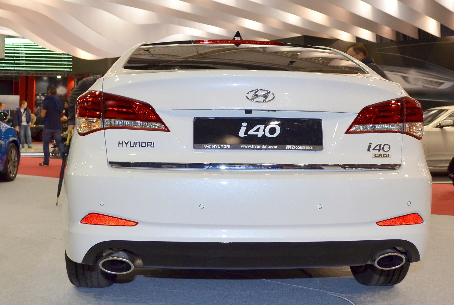 Rear view of sedan with dual exhaust and distinctive taillights