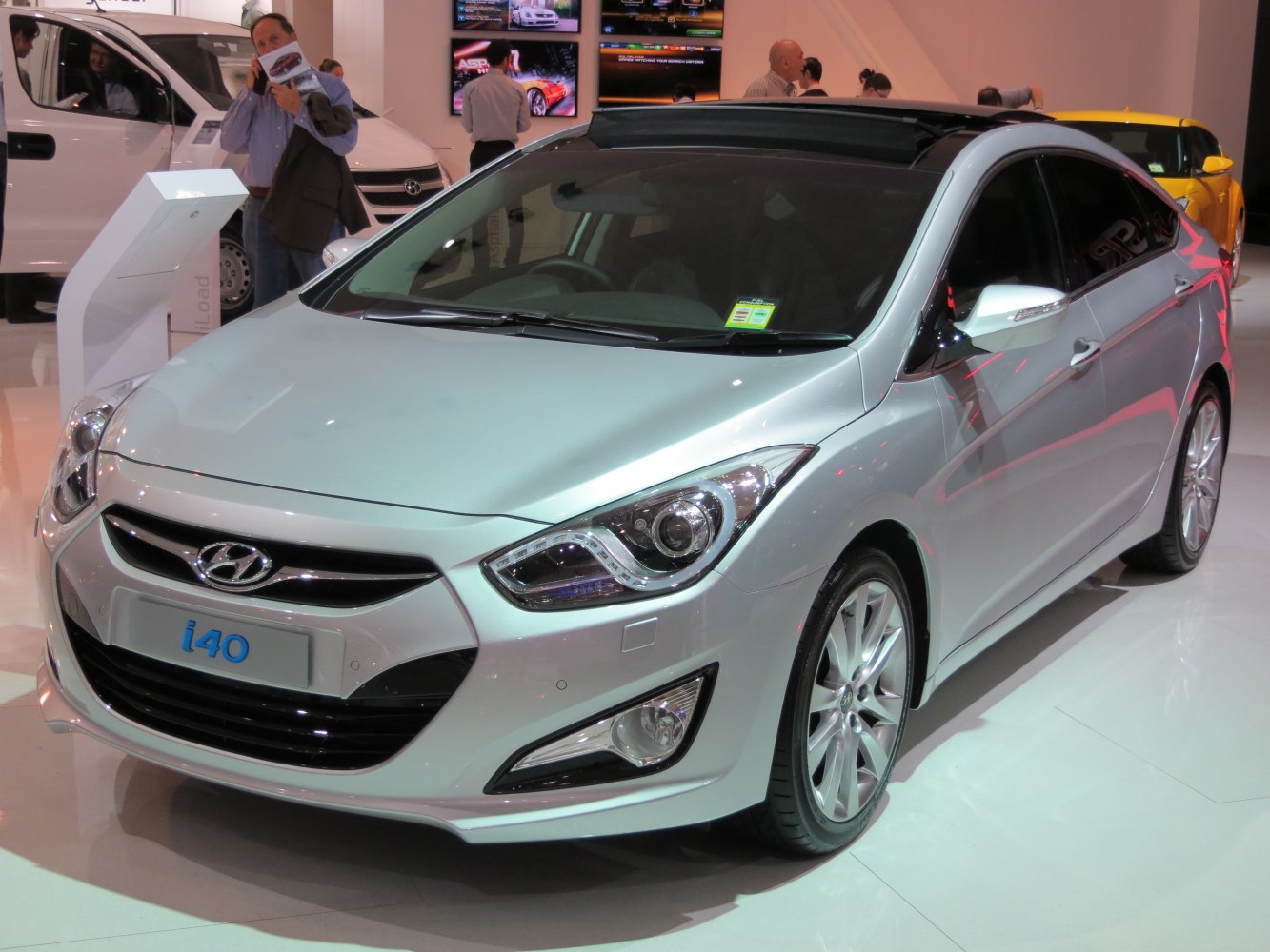 Front view of sedan with panoramic sunroof and detailed headlight design