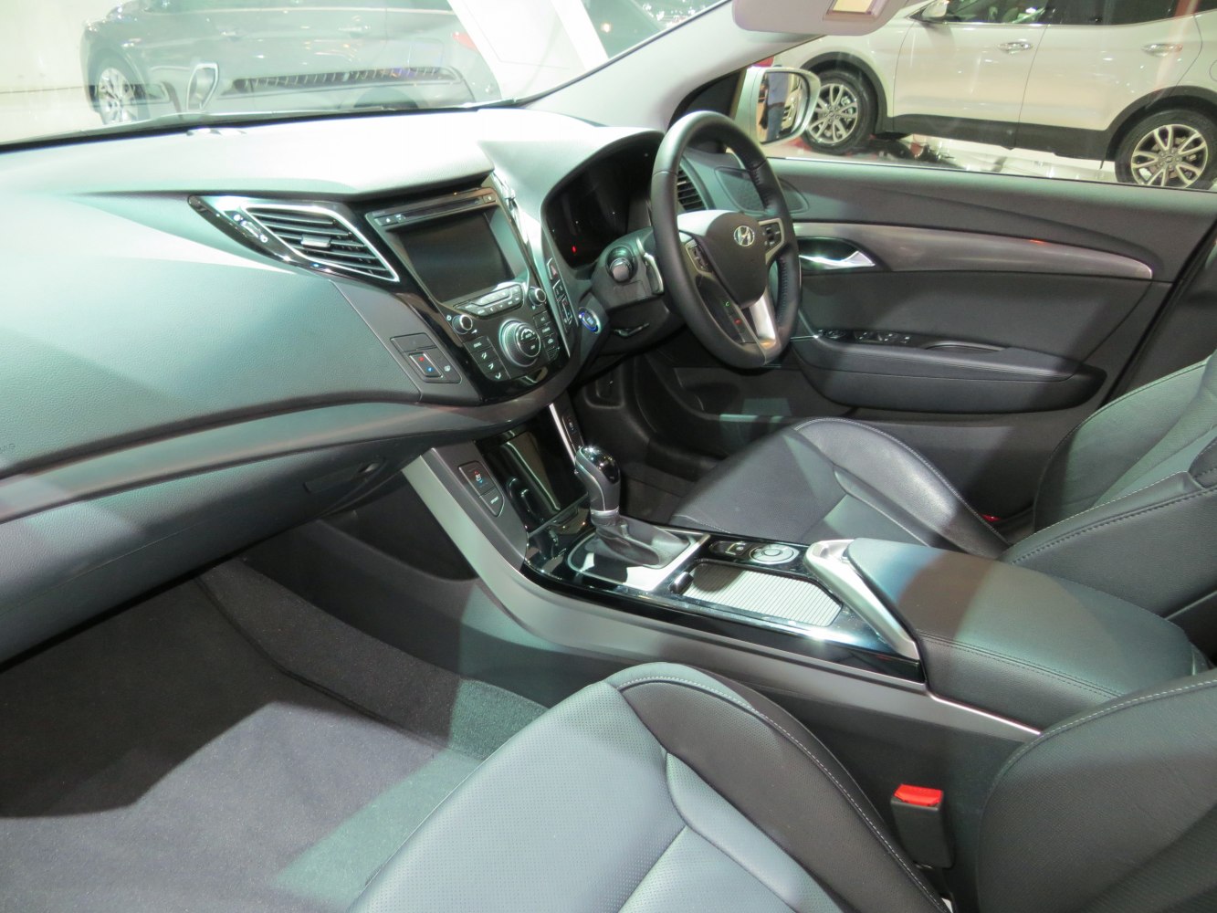 Interior dashboard and center console with steering wheel and gear shift