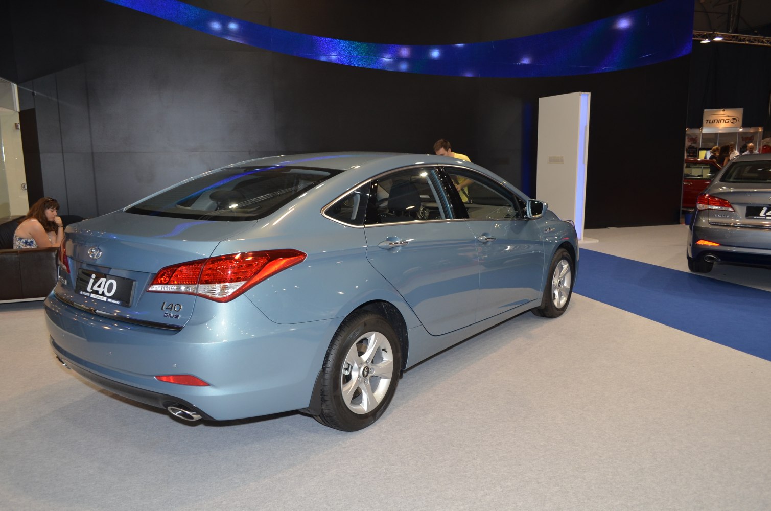 Rear side view showing aerodynamic shape and taillights