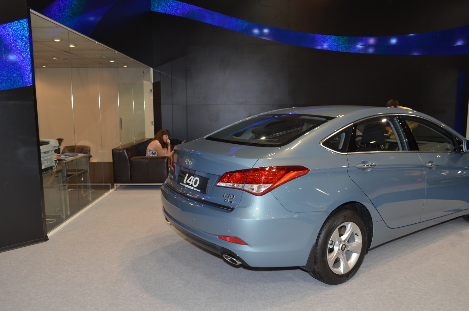 Rear view of sedan with taillights and exhaust pipe