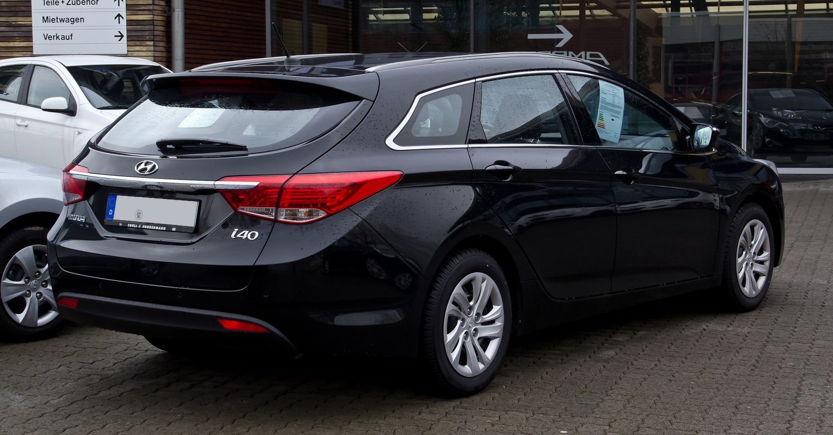 Rear and side profile with tail lights and rear window