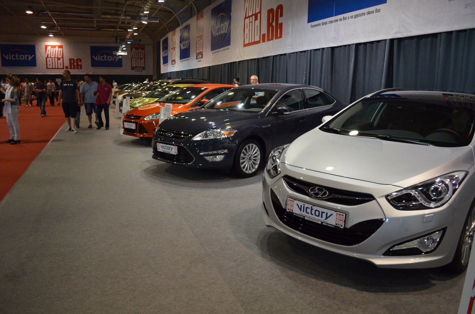 Front and side views of modern mid-size sedans in a lineup