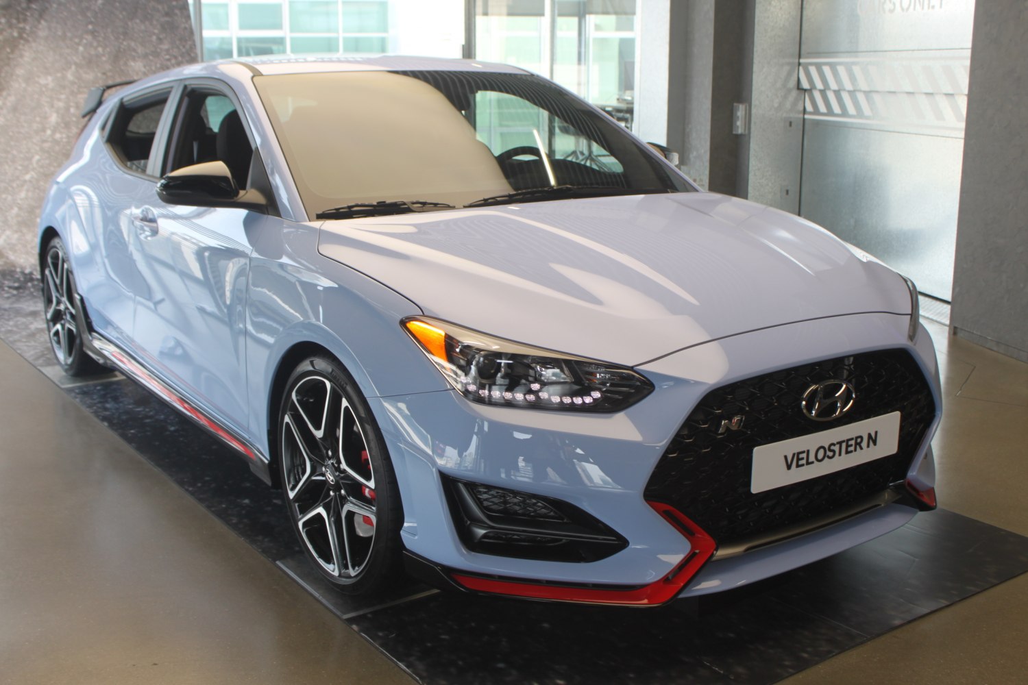 Sporty front angle with distinctive grille and headlights
