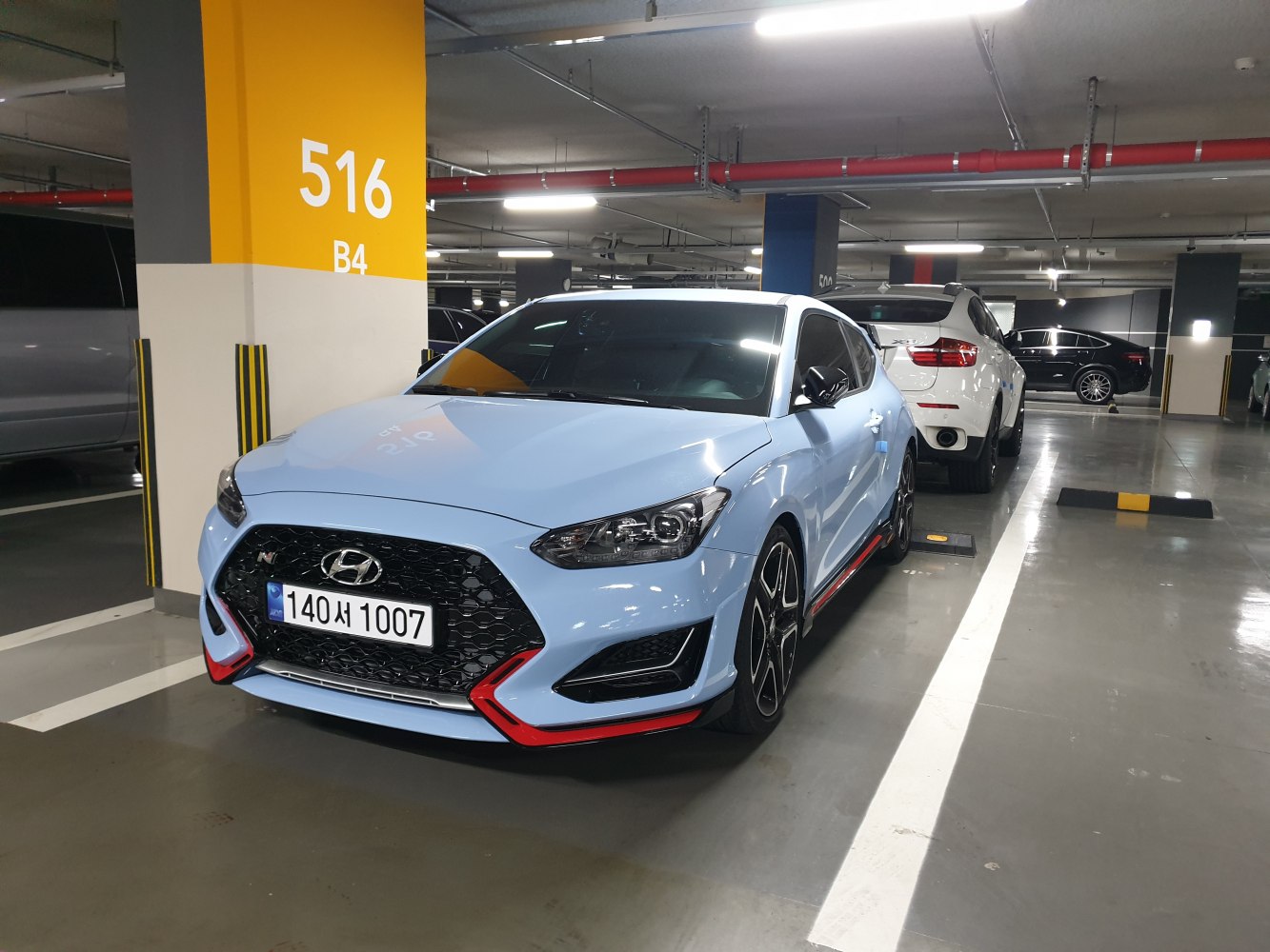 Sporty front view with aggressive grille and headlights