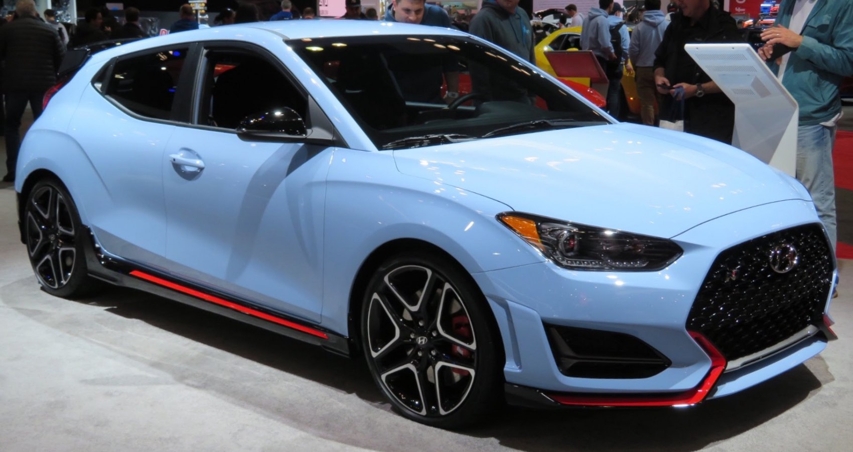 Sporty hatchback front and side view with black grille and alloy wheels
