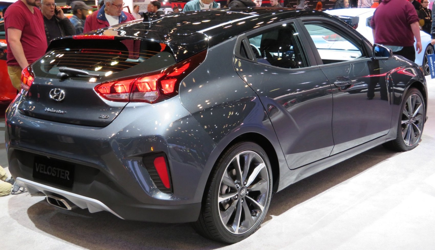 Sporty hatchback rear and side profile with distinctive taillights and alloy wheels