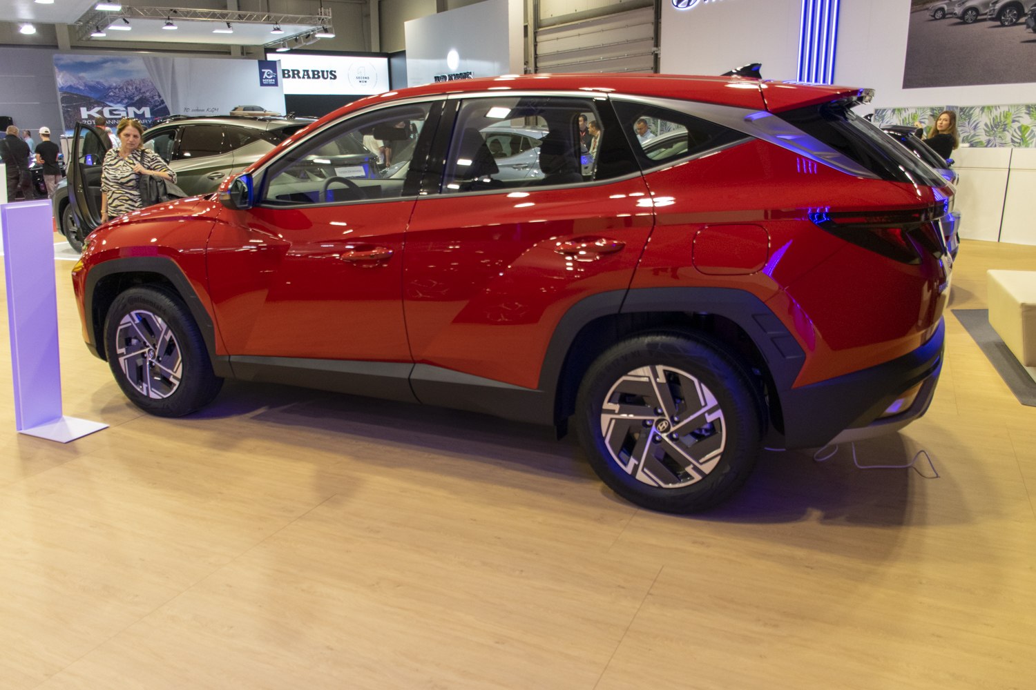 Sleek side profile and modern alloy wheels of a red SUV