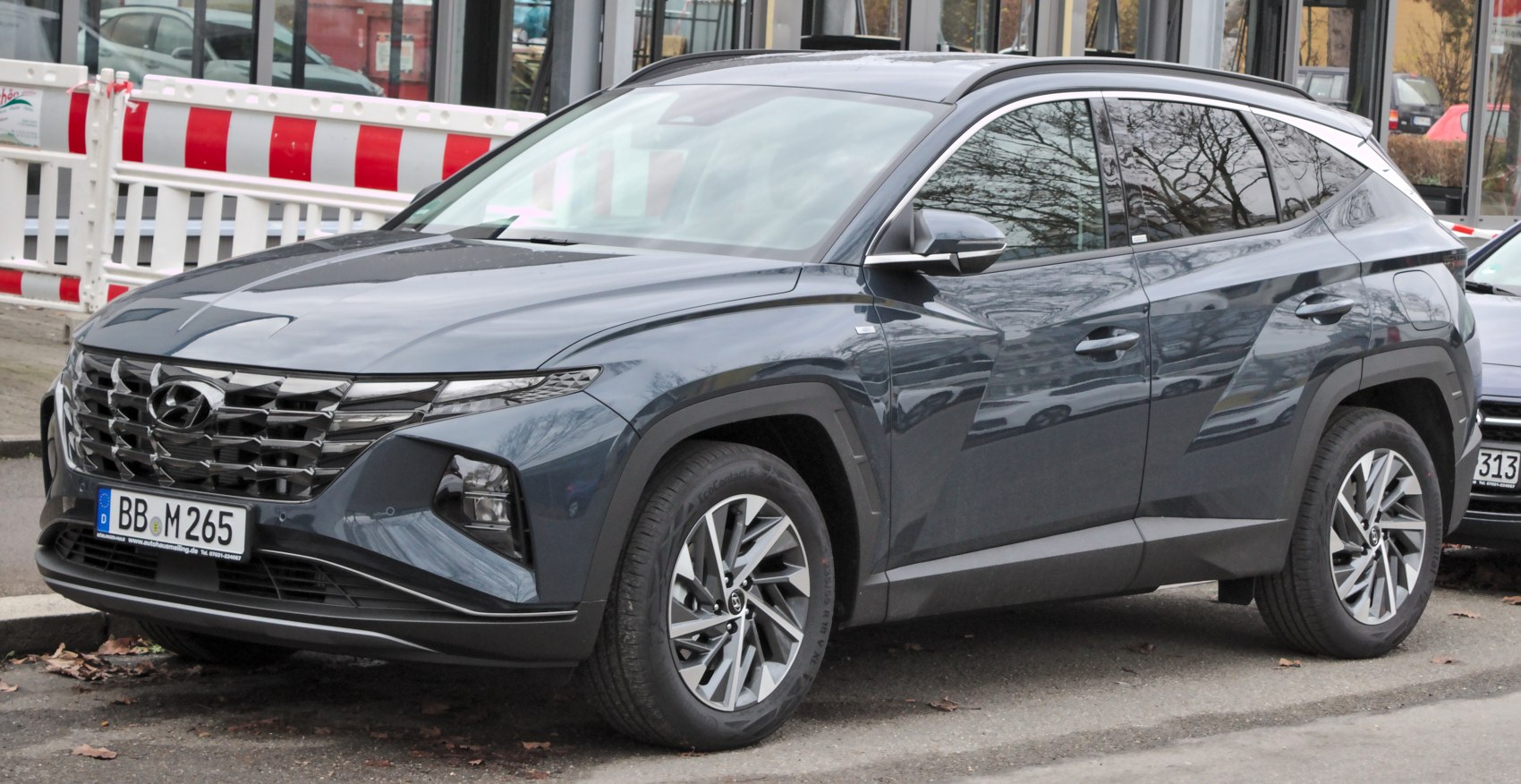 Front three-quarter view with distinctive grille and LED headlights
