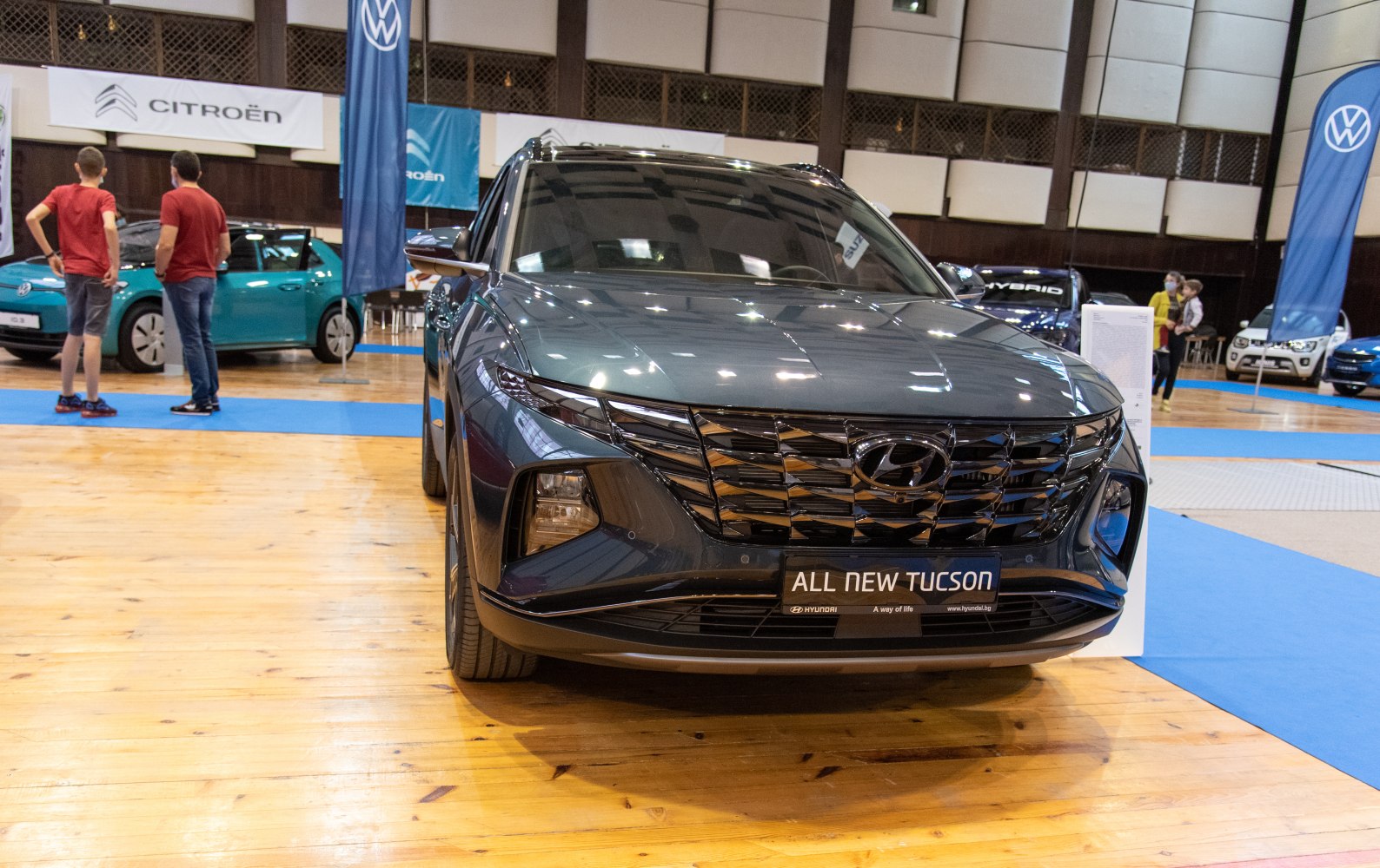 Front view of SUV featuring a distinctive grille and sharp headlights