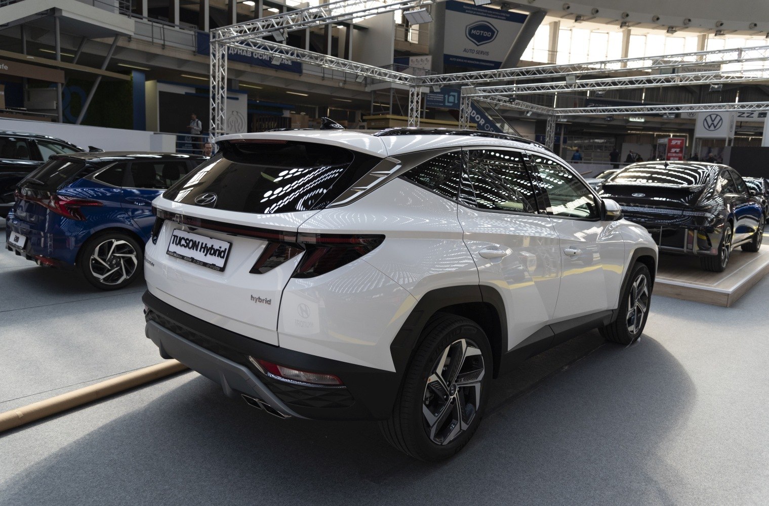 Angular rear design and alloy wheels on a white hybrid SUV