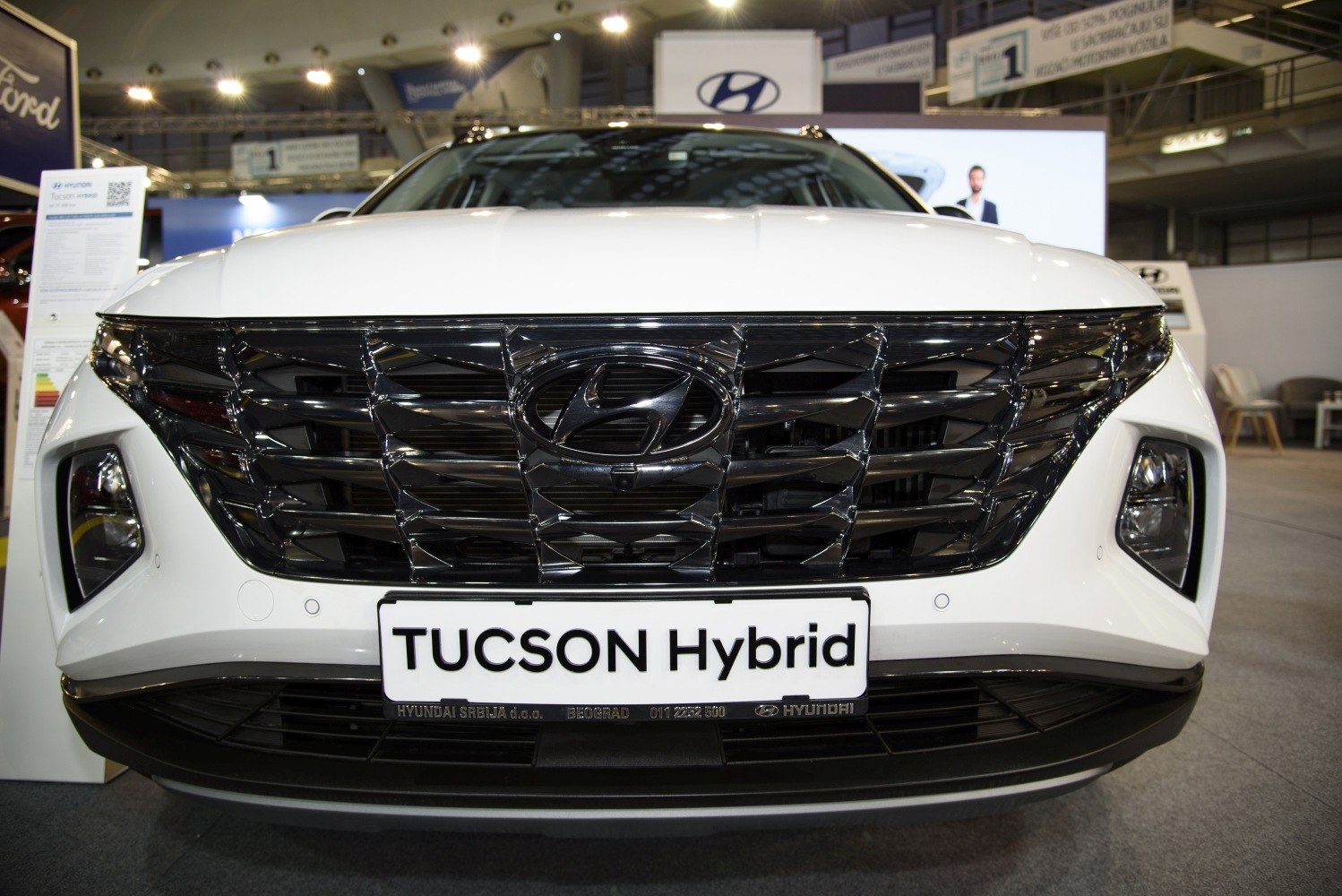 Close-up of Hyundai SUV front grille and headlights