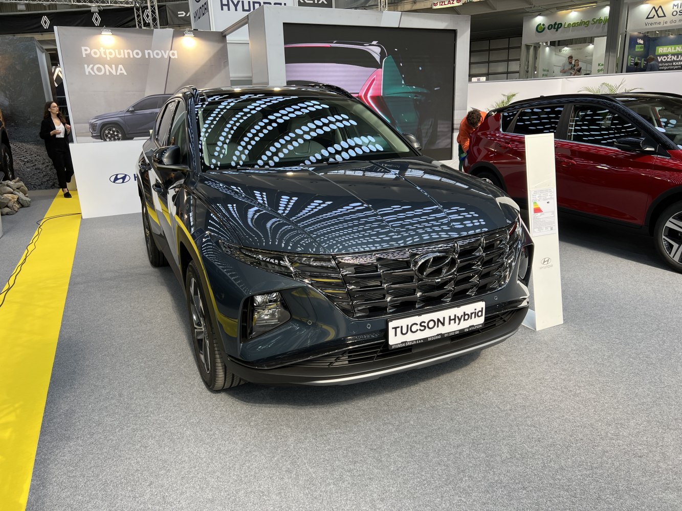 Front view of a modern SUV with prominent grille and sleek headlights.