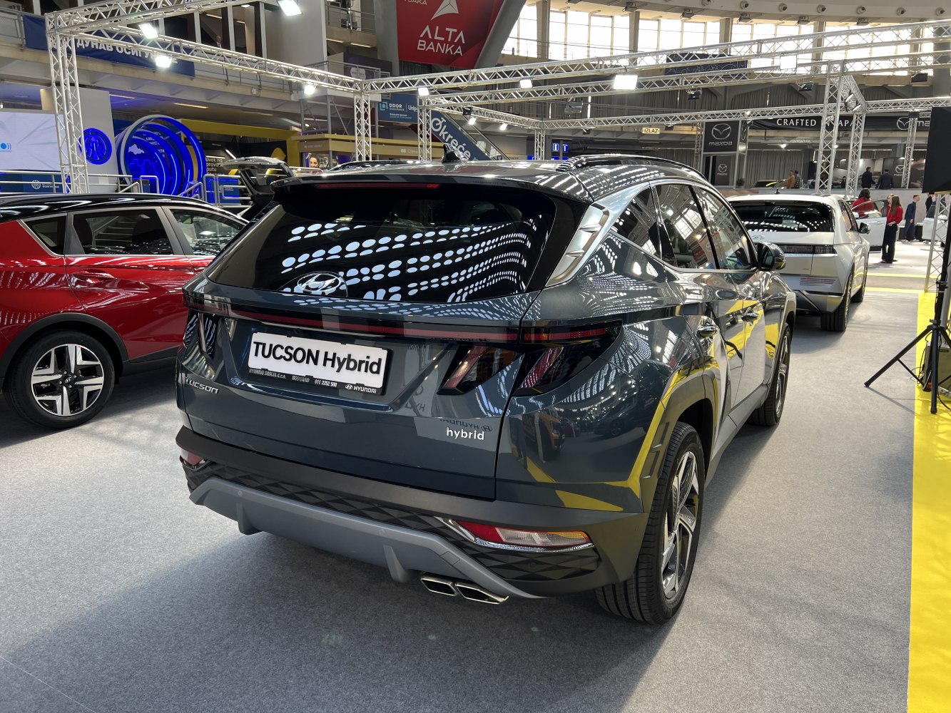 Rear of hybrid SUV with LED tail lights and dual exhaust
