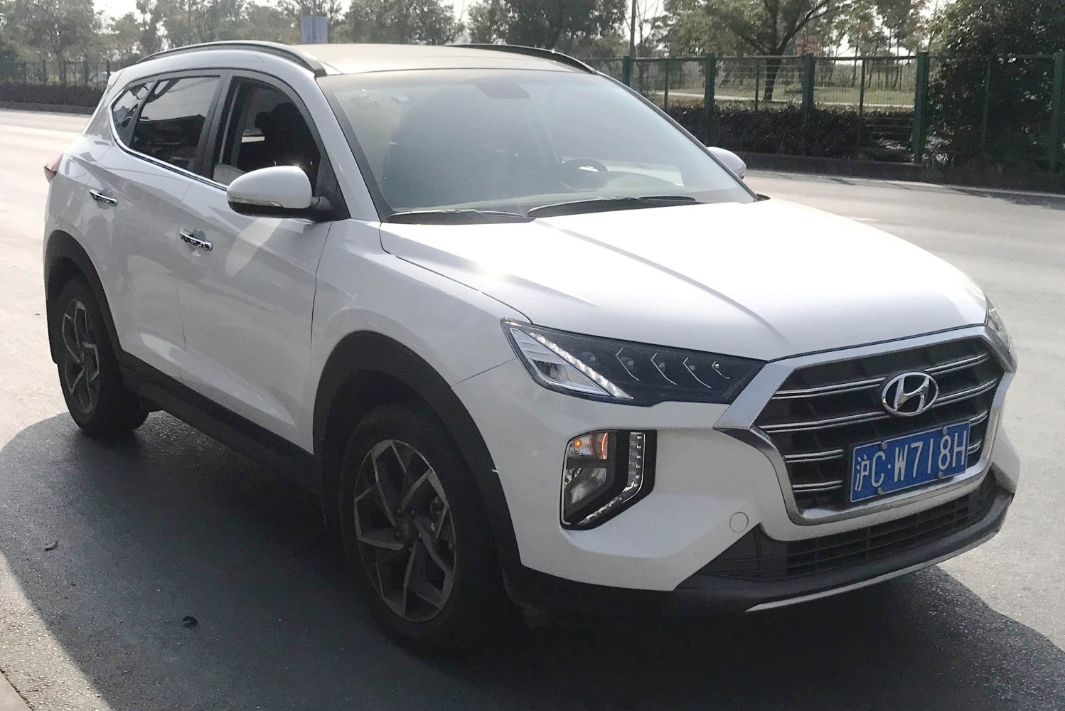 Front and side view with modern grille and headlights